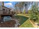 Scenic backyard features a patio, lush garden, and mature trees, creating a private outdoor retreat at 3119 18Th Ne St, Hickory, NC 28601