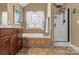 Relaxing bathroom with a soaking tub, walk-in shower, and decorative window at 3119 18Th Ne St, Hickory, NC 28601