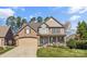 Charming two-story home featuring a blend of brick and stone, front porch, and manicured lawn at 3119 18Th Ne St, Hickory, NC 28601