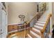 Elegant foyer with hardwood floors, staircase with iron railings, and decorative details at 3119 18Th Ne St, Hickory, NC 28601