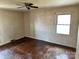Empty bedroom featuring hardwood floors, ceiling fan, and a window providing natural light at 314 N Little Texas Rd, Kannapolis, NC 28083