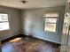Bedroom with hardwood floors, natural light streaming through two windows at 314 N Little Texas Rd, Kannapolis, NC 28083