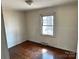 Bedroom with hardwood floors and natural light streaming through a window at 314 N Little Texas Rd, Kannapolis, NC 28083