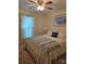 Comfortable bedroom with a decorative quilt on the bed, light walls, and natural light streaming in at 319 Vista Grande Cir, Charlotte, NC 28226