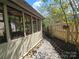 Covered patio with a view of the side yard and fence at 319 Vista Grande Cir, Charlotte, NC 28226