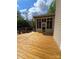 View of the home's wood deck and screened-in porch offering a relaxing outdoor space for entertaining at 319 Vista Grande Cir, Charlotte, NC 28226