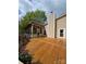 Wide angle view of a deck with a covered porch area and a chimney at 319 Vista Grande Cir, Charlotte, NC 28226