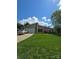 Charming home featuring a well-manicured lawn, stone accents, and neutral siding under a bright blue sky at 319 Vista Grande Cir, Charlotte, NC 28226