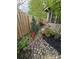 View of landscaped yard with decorative rocks and plants enhancing the home's curb appeal at 319 Vista Grande Cir, Charlotte, NC 28226