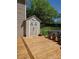 The backyard wooden deck area features a storage shed and potted plants at 319 Vista Grande Cir, Charlotte, NC 28226