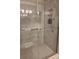 Updated bathroom shower stall with sliding glass door, tiled walls, and recessed shelves at 319 Vista Grande Cir, Charlotte, NC 28226
