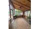 Charming sunroom with wood paneling, ample windows, and a view of the outdoor garden at 319 Vista Grande Cir, Charlotte, NC 28226