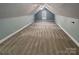 Large attic offers spacious living area with natural light and neutral carpet at 3865 Granite St, Terrell, NC 28682