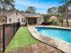 Inviting backyard with an in-ground swimming pool, hot tub, and manicured landscaping at 3865 Granite St, Terrell, NC 28682