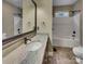 Bathroom featuring a granite countertop vanity and a shower-tub combo at 3865 Granite St, Terrell, NC 28682