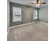 Carpeted bedroom with two windows, neutral walls and a ceiling fan at 3865 Granite St, Terrell, NC 28682