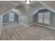 Bonus room with carpet, two windows, and sloped ceilings at 3865 Granite St, Terrell, NC 28682