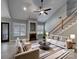 Bright living room with vaulted ceiling, fireplace, and staircase at 3865 Granite St, Terrell, NC 28682