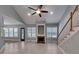 Spacious living room with tile flooring, fireplace, ceiling fan, and staircase at 3865 Granite St, Terrell, NC 28682
