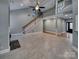 Open living room with high ceilings, tile floors, fireplace, and a staircase leading to the second floor at 3865 Granite St, Terrell, NC 28682