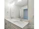 Bathroom features double sink vanity with a large mirror at 4009 Grace Pointe Dr # 101, Indian Trail, NC 28079