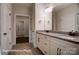 A spacious bathroom features double sinks with granite countertops and neutral tiling at 4009 Grace Pointe Dr # 101, Indian Trail, NC 28079
