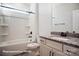 Bathroom featuring shower-tub combo, granite vanity, and bronze fixtures at 4009 Grace Pointe Dr # 101, Indian Trail, NC 28079