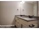 Bathroom featuring granite countertops and dual sinks with modern fixtures at 4009 Grace Pointe Dr # 101, Indian Trail, NC 28079