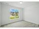 Bright bedroom with a view of the outdoors, providing a serene and inviting space at 4009 Grace Pointe Dr # 101, Indian Trail, NC 28079