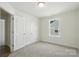 Bedroom with carpet, double door closet and window at 4009 Grace Pointe Dr # 101, Indian Trail, NC 28079
