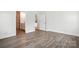 Bedroom featuring wood-look floors and neutral color palette at 4009 Grace Pointe Dr # 101, Indian Trail, NC 28079