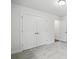 Bedroom featuring closet with double doors, neutral paint, and plush carpet at 4009 Grace Pointe Dr # 101, Indian Trail, NC 28079