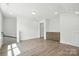 Bonus room with hardwood floors, recessed lights and built in storage cabinets at 4009 Grace Pointe Dr # 101, Indian Trail, NC 28079