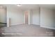 Spacious carpeted bonus room with recessed lighting and neutral paint at 4009 Grace Pointe Dr # 101, Indian Trail, NC 28079