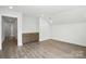 Bright bonus room featuring durable flooring, built in storage cabinets, and fresh neutral paint at 4009 Grace Pointe Dr # 101, Indian Trail, NC 28079