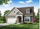 Charming single-Gathering home featuring a two-car garage and craftsman style details at 4009 Grace Pointe Dr # 101, Indian Trail, NC 28079