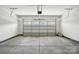 Spacious two car garage featuring an automatic door and concrete floor at 4009 Grace Pointe Dr # 101, Indian Trail, NC 28079