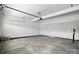 Spacious garage with room for storage and a door leading to the inside of the house at 4009 Grace Pointe Dr # 101, Indian Trail, NC 28079