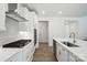 Modern kitchen with stainless steel appliances, white cabinetry, and a spacious island at 4009 Grace Pointe Dr # 101, Indian Trail, NC 28079