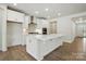 Spacious kitchen with a large center island, stainless steel appliances, and white cabinetry at 4009 Grace Pointe Dr # 101, Indian Trail, NC 28079