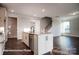 Well-appointed kitchen island overlooking the open-concept living area and staircase at 4009 Grace Pointe Dr # 101, Indian Trail, NC 28079
