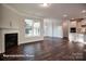 Bright living area with a fireplace, hardwood floors, and open access to kitchen at 4009 Grace Pointe Dr # 101, Indian Trail, NC 28079