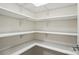 Walk-in pantry with white shelving, providing ample storage space in the kitchen at 4009 Grace Pointe Dr # 101, Indian Trail, NC 28079