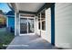 Covered patio and sliding glass doors that create seamless indoor-outdoor living and entertainment space at 4009 Grace Pointe Dr # 101, Indian Trail, NC 28079