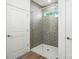 Sleek shower with glass enclosure and modern tile at 4009 Grace Pointe Dr # 101, Indian Trail, NC 28079