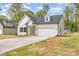 A cozy single-Gathering home boasting classic architecture, a well-kept lawn, and an attached garage for convenience at 402 Walker St, Kannapolis, NC 28081