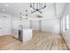 Modern living area featuring recessed lights, a ceiling fan, an island sink, and a stylish open-concept design at 402 Walker St, Kannapolis, NC 28081