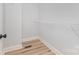 A walk-in closet with wood-look flooring and a wire rack shelf at 402 Walker St, Kannapolis, NC 28081