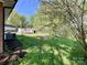 Expansive backyard with a small shed and lush greenery, perfect for outdoor activities at 418 Dallas Stanley Hwy, Dallas, NC 28034