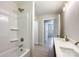 Bright bathroom features a shower-tub combination, vanity with gold hardware, and natural light at 418 Dallas Stanley Hwy, Dallas, NC 28034